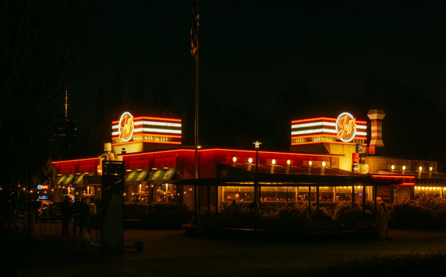 A retro diner glowing with neon at night